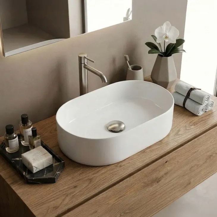Lavabo bagno da appoggio 56x35cm a bacinella in ceramica bianco lucido Goccia